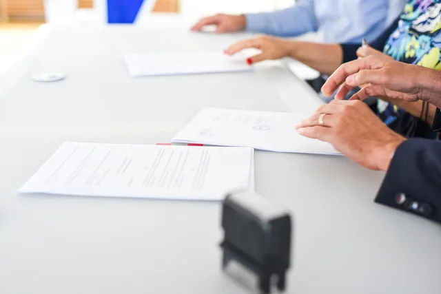 agreement, contract signing, table, hands, sign, contract, paper, paper work, meeting, business, closeup, agreement, contract, contract, contract, contract, contract. Workplace policy procedure for employee publications: what each section must decide